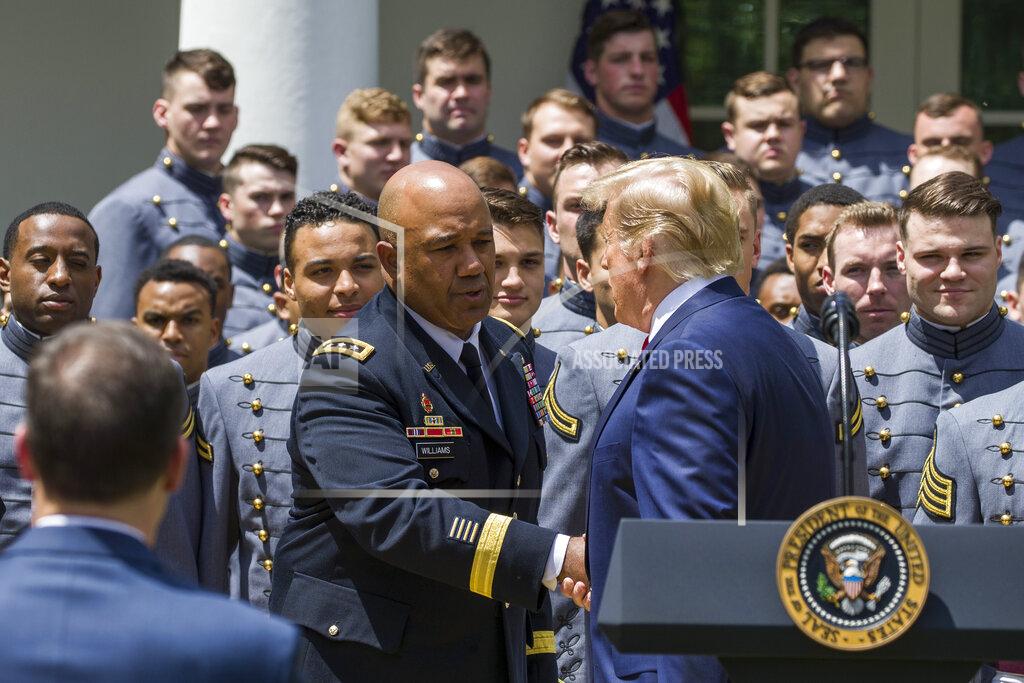 Alex Brandon West Point Superintendent Lt. Gen. Darryl Williams, center, shakes hands with President Donald Trump during the presentation of the Commander-in-Chief's Trophy to the U.S. Military Academy at West Point football team, in the Rose Garden of the White House, Monday, May 6, 2019, in Washington. (AP Photo/Alex Brandon)