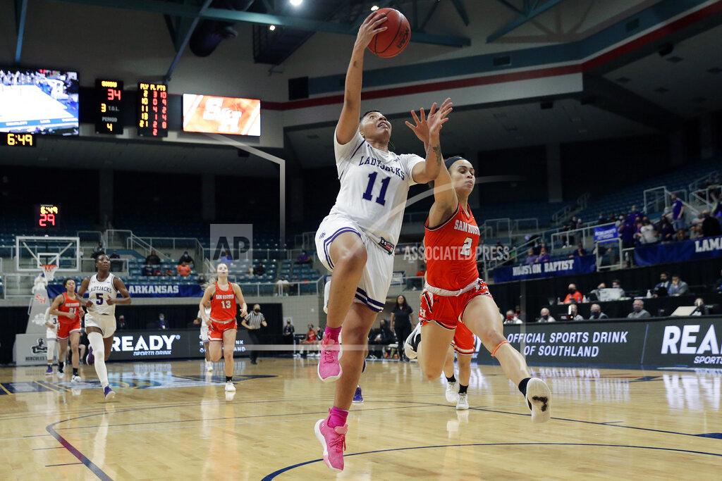 Michael Wyke Stephen F. Austin forward Avery Brittingham (11) puts up a shot past Sam Houston State forward Amber Leggett (2) during the second half of an NCAA college basketball game for the Southland Conference women's tournament championship Sunday, March 14, 2021, in Katy, Texas. (AP Photo/Michael Wyke)