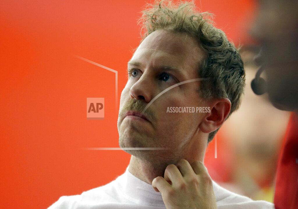 Luca Bruno Ferrari driver Sebastian Vettel of Germany looks at his results after the second free practice at the Formula One Bahrain International Circuit in Sakhir, Bahrain, Friday, March 29, 2019. The Bahrain Formula One Grand Prix will take place on Sunday. (AP Photo/Luca Bruno)