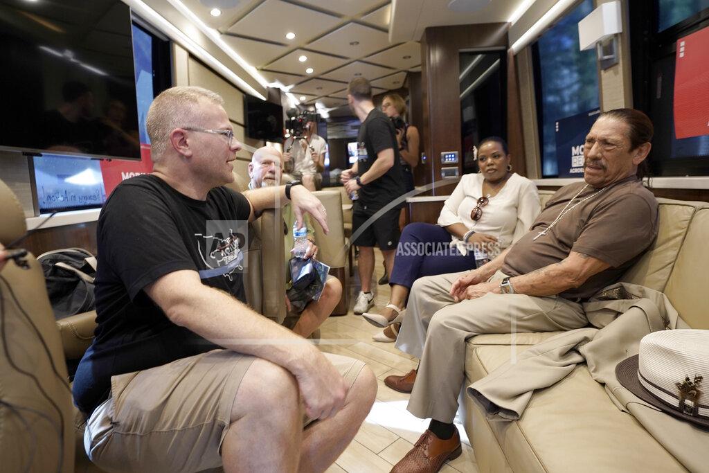 Rich Pedroncelli Ryan Hampton, founder of the Voices Project, left, talks with actor Danny Trejo, aboard the 2022 Mobile Recovery National Bus during a stop in Sacramento, Calif., Wednesday, Sept. 7, 2022. Trejo spoke at the recovery rally telling the crowd about his past problems with drug addiction. Across the country, people in recovery and relatives of those killed by opioid overdoses are pressing for roles in determining how billions in opioid settlement money will be used. That push is one of the missions of the monthlong nationwide bus tour. (AP Photo/Rich Pedroncelli)