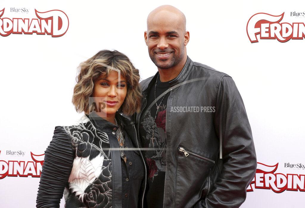Willy Sanjuan FILE - Boris Kodjoe, right, and Nicole Ari Parker arrive at the premiere of "Ferdinand" in Los Angeles on Dec. 10, 2017. The couple gave away thousands of face masks to essential workers and first responders during the pandemic. Parker's apparel company, Gymwrap, turned its attention from making headbands to crafting masks for the couple's Help Our Heroes campaign. (Photo by Willy Sanjuan/Invision/AP, File)