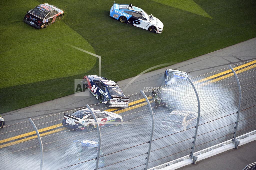 Phelan M. Ebenhack William Byron (24), Martin Truex Jr. (19) and Kurt Busch (1) are involved in a multi-car accident along the front stretch after a restart from an earlier accident during the NASCAR Daytona Clash auto race at Daytona International Speedway, Sunday, Feb. 9, 2020, in Daytona Beach, Fla. (AP Photo/Phelan M. Ebenhack)