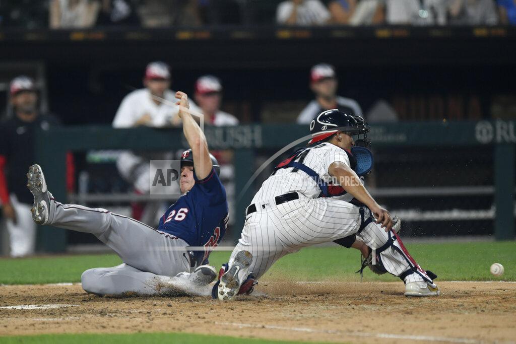 Paul Beaty Minnesota Twins' Max Kepler (26) slides safely into home plate on a Alex Kirilloff two-RBI single while Chicago White Sox catcher Seby Zavala right, awaits the ball during the tenth inning of a baseball game Monday, July 4, 2022, in Chicago. (AP Photo/Paul Beaty)