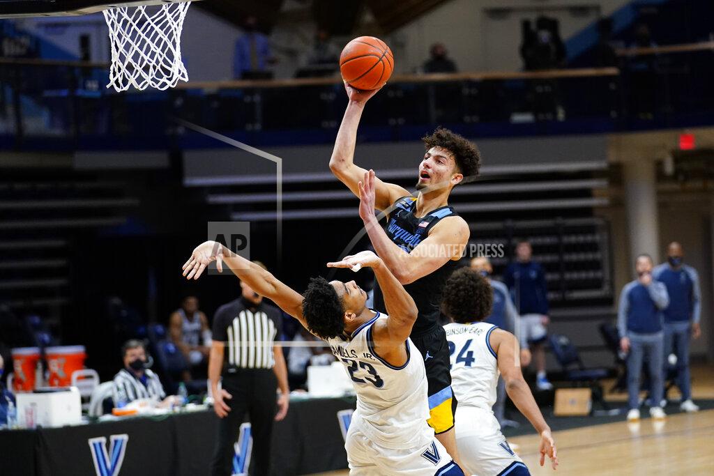 Matt Slocum Marquette's Dawson Garcia, top, goes up for a shot against Villanova's Jermaine Samuels during the second half of an NCAA college basketball game, Wednesday, Feb. 10, 2021, in Villanova, Pa. (AP Photo/Matt Slocum)