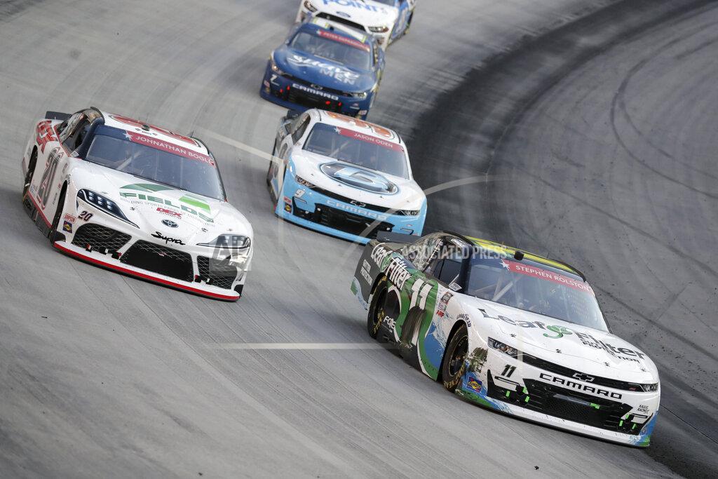 Mark Humphrey Harrison Burton (20) goes high around Justin Haley (11) during NASCAR Xfinity Series auto race at Bristol Motor Speedway Monday, June 1, 2020, in Bristol, Tenn. (AP Photo/Mark Humphrey)