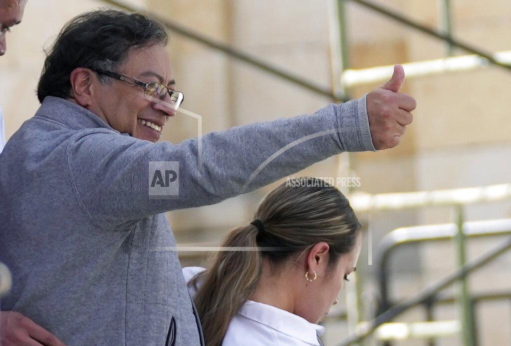 Fernando Vergara Gustavo Petro, presidential candidate with the Historical Pact coalition, gestures to his supporters during a closing campaign rally in Zipaquira, Colombia, Sunday, May 22, 2022. Elections are set for May 29. (AP Photo/Fernando Vergara)