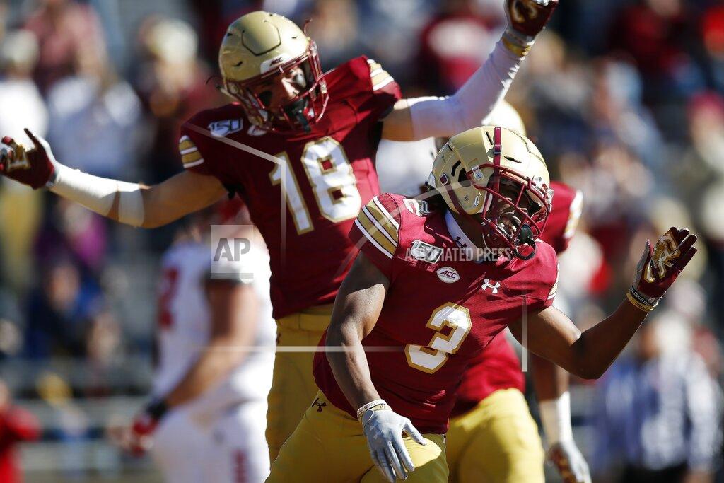 Michael Dwyer Boston College defensive back Jason Maitre (3) celebrates his interception and touchdown during the first half of an NCAA college football game against North Carolina State in Boston, Saturday, Oct. 19, 2019. (AP Photo/Michael Dwyer)