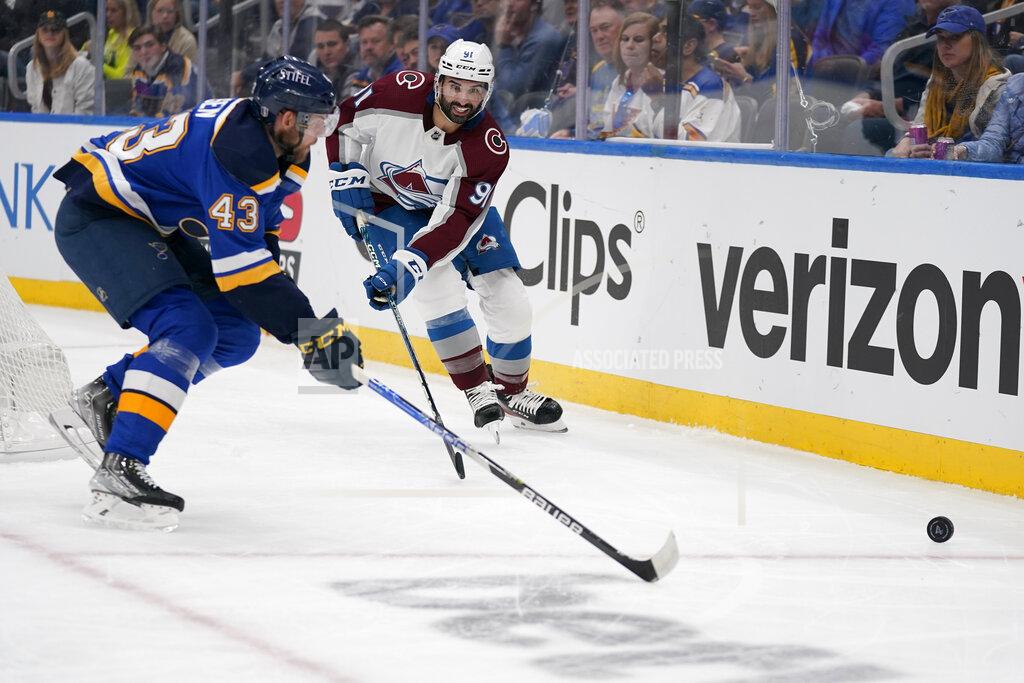 Jeff Roberson Colorado Avalanche's Nazem Kadri (91) and St. Louis Blues' Calle Rosen (43) chase after a loose puck along the boards during the first period in Game 4 of an NHL hockey Stanley Cup second-round playoff series Monday, May 23, 2022, in St. Louis. (AP Photo/Jeff Roberson)