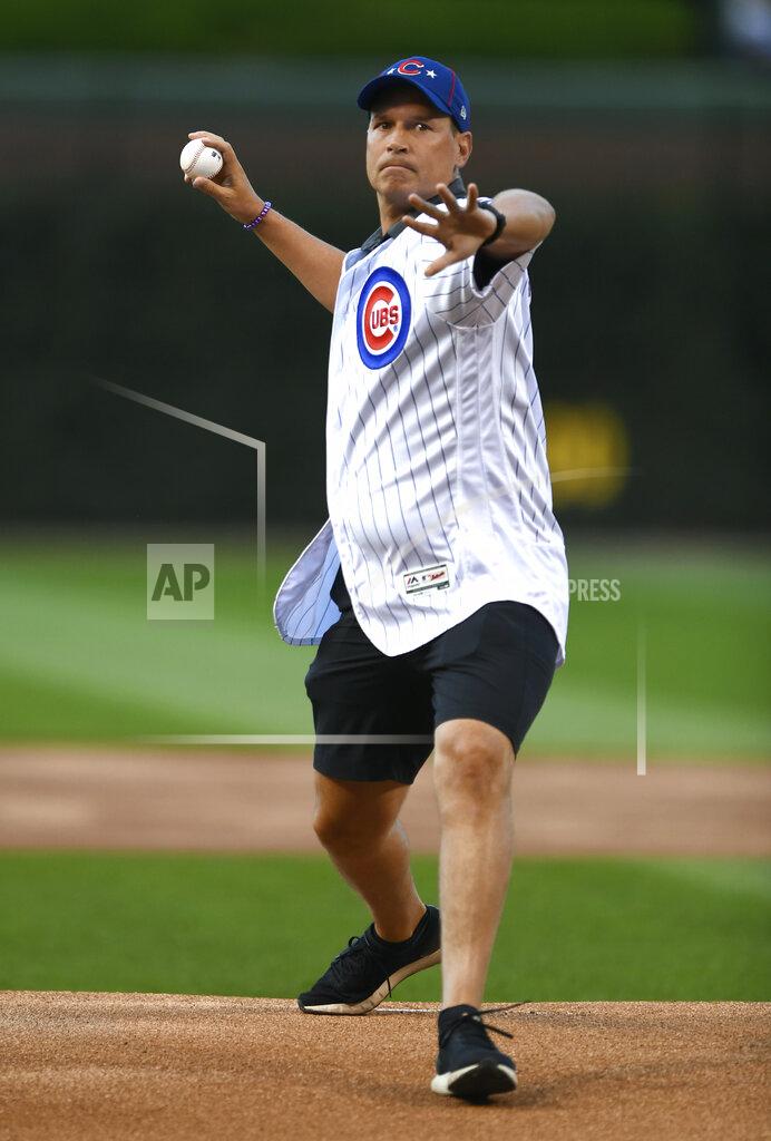 Paul Beaty Northwestern men's basketball coach Chris Collins throws out a ceremonial first pitch before a baseball game between the Chicago Cubs and the Atlanta Braves on Wednesday, June 26, 2019, in Chicago. (AP Photo/Paul Beaty)