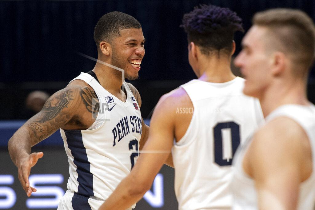 Noah Riffe CORRECTS TO MYLES DREAD, INSTEAD OF JAMARI WHEELER - Penn State guard Myles Dread (2) celebrates with guard Myreon Jones (0) after scoring a buzzer-beater 3-point shot against Minnesota during an NCAA college basketball game Wednesday, March 3, 2021, in State College, Pa. (Noah Riffe/Centre Daily Times via AP)