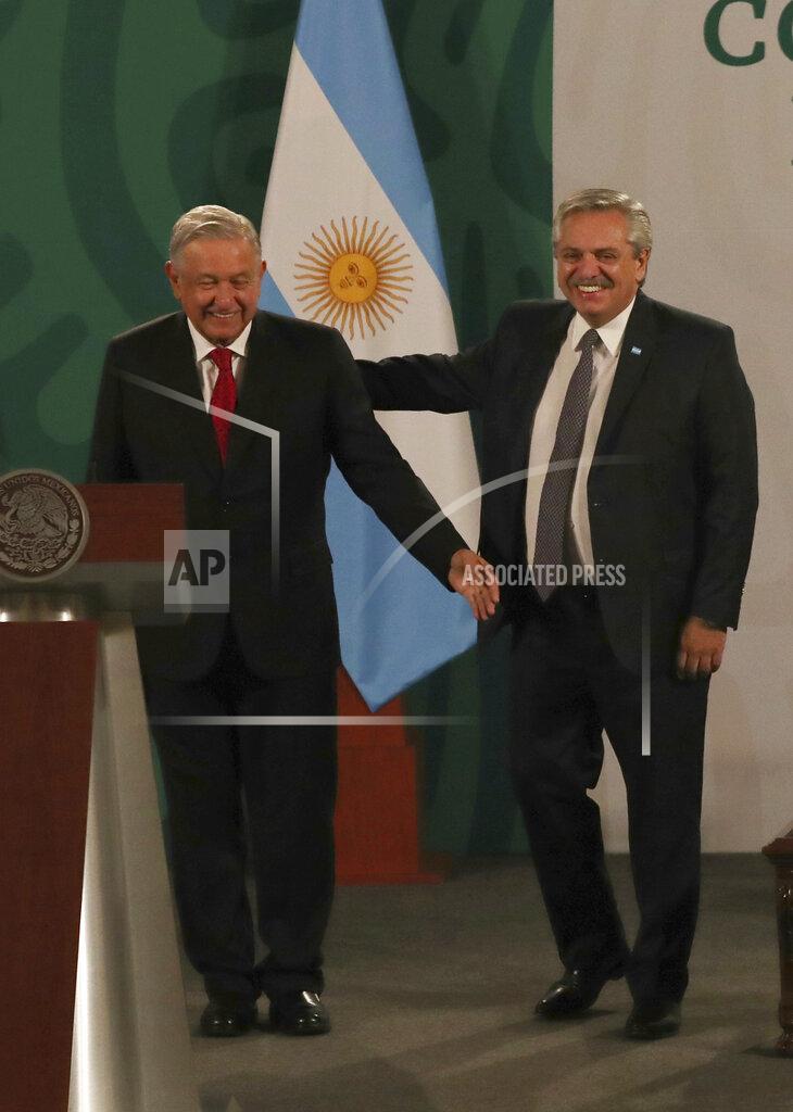 Marco Ugarte Argentina's President Alberto Fernández, right, arrives with Mexican President Andrés Manuel López Obrador for the Mexican president's daily, morning press conference at the National Palace in Mexico City, Tuesday, Feb. 23, 2021. Fernández is on a four-day official visit to Mexico. (AP Photo/Marco Ugarte)