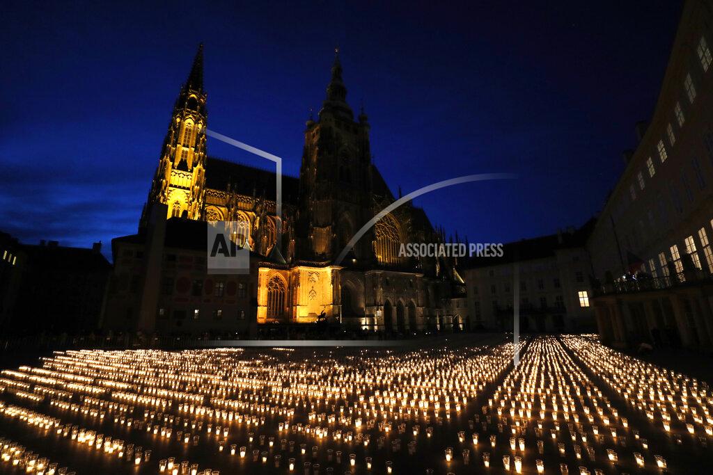 Petr David Josek Candles are lit to commemorate victims of the COVD-19 pandemic at the Prague Castle in Prague, Czech Republic, Monday, May 10, 2021. The Czech Republic is massively relaxing its coronavirus restrictions as the hard-hit nation pays respect to nearly 30,000 dead. (AP Photo/Petr David Josek)