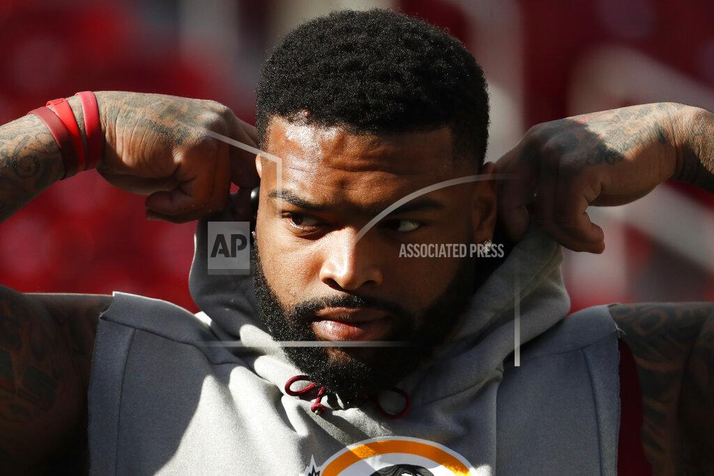Andrew Harnik FILE - In this Oct. 21, 2018, file photo, Washington Redskins offensive tackle Trent Williams takes the field for warm ups before an NFL football game against the Dallas Cowboys, in Landover, Md. The agent for Trent Williams says he would like the Washington Redskins to trade or release their longtime starting left tackle. Agent Vince Taylor sent a statement with the request to the Associated Press on Tuesday, March 24, 2020. Taylor says the relationship between Williams and the team had reached a point where it's in everyone's best interest for the 31-year-old to be traded or released and cited irreconcilable differences. (AP Photo/Andrew Harnik, File)