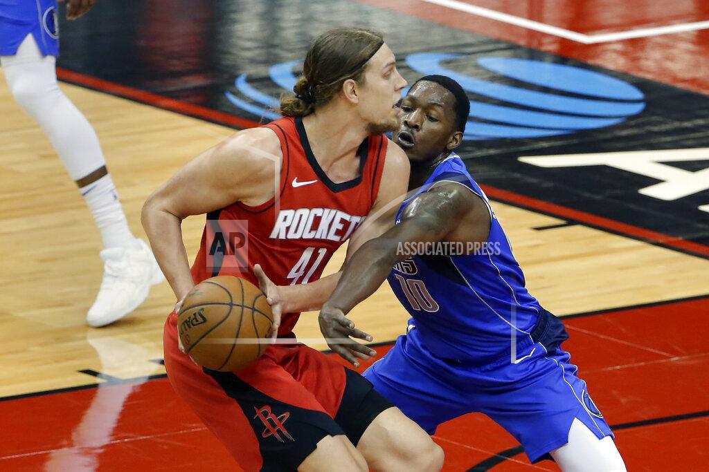 Michael Wyke Houston Rockets forward Kelly Olynyk (41) avoids the reach in by Dallas Mavericks forward Dorian Finney-Smith (10) during the first half of an NBA basketball game Wednesday, April 7, 2021, in Houston. (AP Photo/Michael Wyke, Pool)