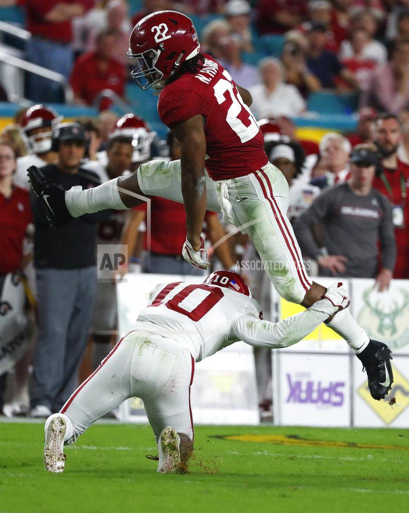 Wilfredo Lee Alabama running back Najee Harris (22) jumps over Oklahoma safety Patrick Fields (10), during the first half of the Orange Bowl NCAA college football game, Saturday, Dec. 29, 2018, in Miami Gardens, Fla. (AP Photo/Wilfredo Lee)