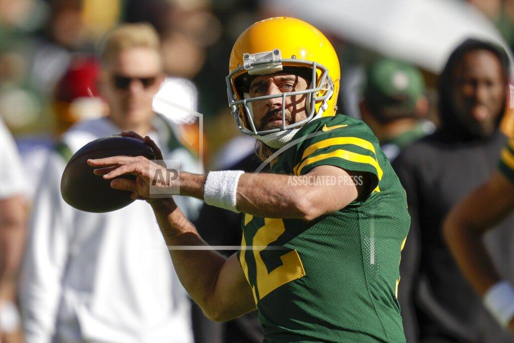 Matt Ludtke Green Bay Packers' Aaron Rodgers warms up before an NFL football game against the Washington Football Team Sunday, Oct. 24, 2021, in Green Bay, Wis. (AP Photo/Matt Ludtke)
