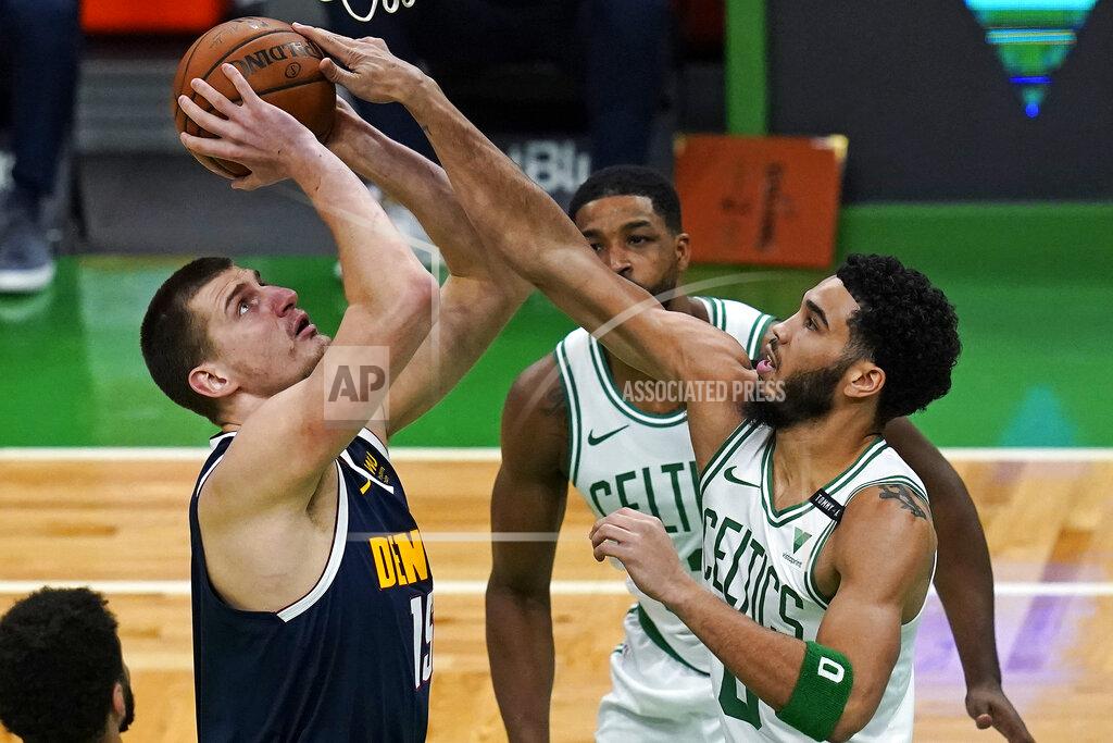Charles Krupa Boston Celtics forward Jayson Tatum, right, blocks a shot by Denver Nuggets center Nikola Jokic, left, during the first half of an NBA basketball game, Tuesday, Feb. 16, 2021, in Boston. (AP Photo/Charles Krupa)
