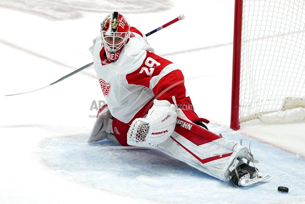 Tony Gutierrez Detroit Red Wings goaltender Thomas Greiss stretches to defend against a shot by the Dallas Stars that went wide of the net in the second period of an NHL hockey game in Dallas, Tuesday, Jan. 26, 2021. (AP Photo/Tony Gutierrez)