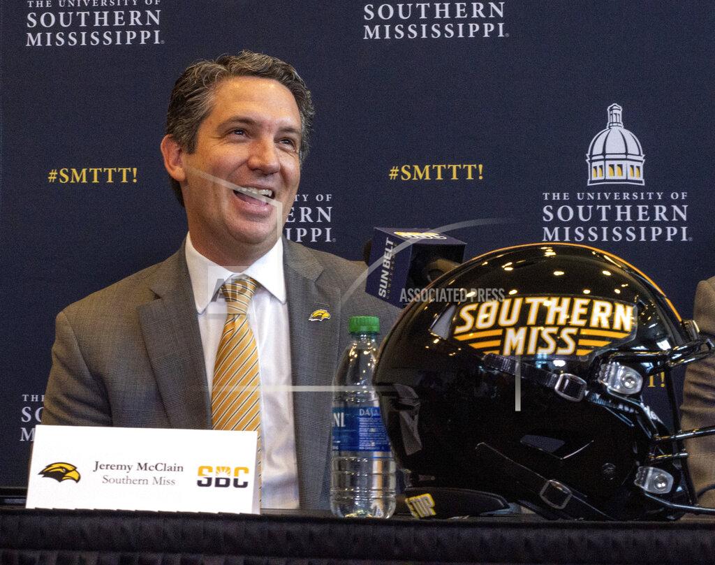 Dominic Gwinn Southern Miss Athletic Director Jeremy McClain laughs during a press conference as the school joins the NCAA Sun Belt Conference at the Southern Miss Trent Lott Center in Hattiesburg, Miss. on Tuesday, Oct. 26, 2021.(Dominic Gwinn/Hattiesburg American via AP)