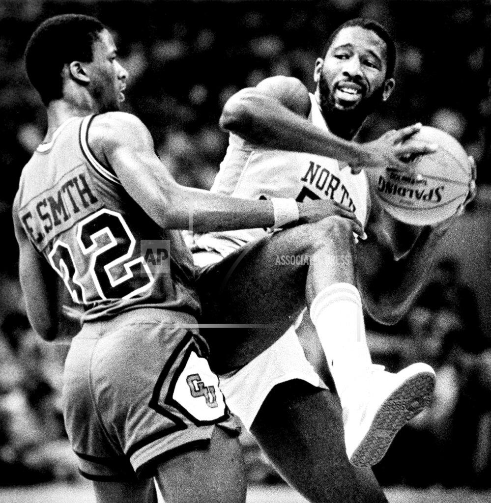Brian Smith FILE - In this March 29, 2020, file photo, North Carolina forward James Worthy, right, keeps the ball away from Eric Smith of Georgetown during the NCAA college basketball Final Four championship game in New Orleans. Worthy won the duel of dunks with Georgetown's Pat Ewing, scoring a career-high 28 points and winning the Most Outstanding Player award. (Brian Smith/The Times-Picayune/The New Orleans Advocate, File)