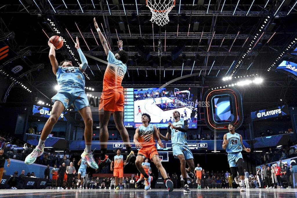 Adam Hagy In this photo provided by Overtime Elite, Dominick Barlow, left, shoots for Team Overtime in a game against Team Elite at OTE Arena in Atlanta, Tuesday, March 8, 2022. Barlow will be one of the 76 prospects at the NBA draft combine this week in Chicago. But he didn’t take the conventional route through the college ranks. Or the NBA’s G League Ignite. Or playing overseas. He turned down college offers to receive on-the-job training through Overtime Elite, a new basketball league created to give high school players another path to the pros. He got paid -- a six-figure salary -- as he learned about nutrition, social-media skills, financial literacy and, of course, the art of basketball. (Adam Hagy/Overtime Elite via AP)