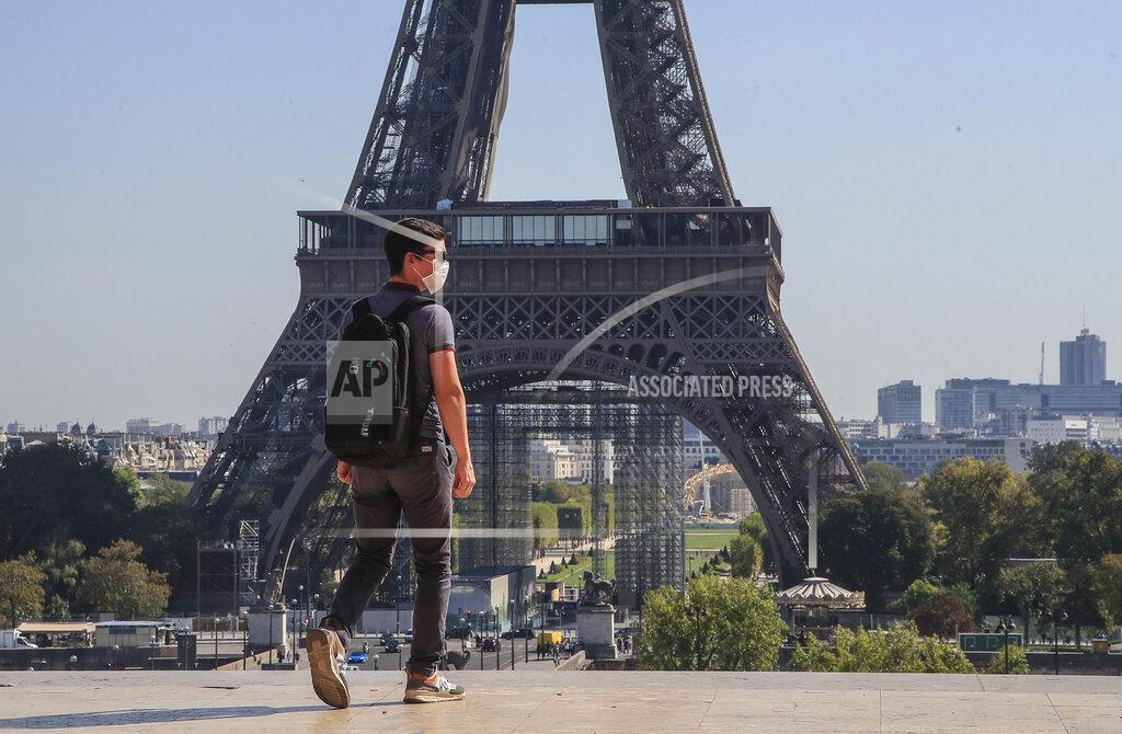Michel Euler A man wearing protective a face mask as precaution against the conoravirus walk at Trocadero plaza near Eiffel Tower in Paris, Monday, Sept. 14, 2020. France sees a substantial increase of Covid-19 cases. (AP Photo/Michel Euler)