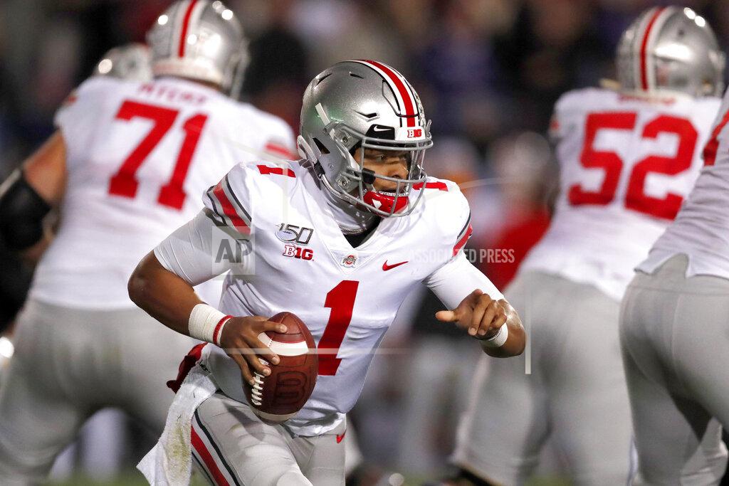 Ohio State quarterback Justin Fields (1) scrambles during the first half of an NCAA college football game against Northwestern, Friday, Oct. 18, 2019, in Evanston, Ill. (AP Photo/Charles Rex Arbogast)