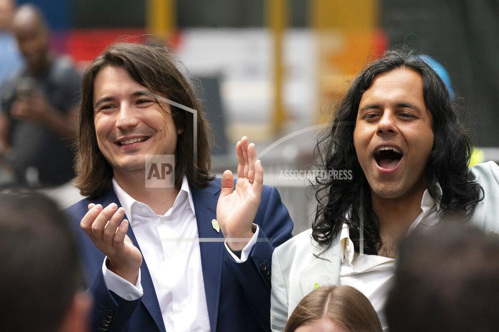Mark Lennihan Vladimir Tenev, CEO and Co-Founder of Robinhood, left, celebrates in New York's Times Square with fellow Co-Founder Baiju Bhatt following their company's IPO, Thursday, July 29, 2021. Robinhood is selling its own stock on Wall Street, the very place the online brokerage has rattled with its stated goal of democratizing finance. Through its app, Robinhood has introduced millions to investing and reshaped the brokerage industry, all while racking up a long list of controversies in less than eight years. (AP Photo/Mark Lennihan)