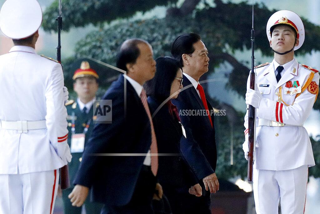 Minh Hoang Former Vietnam's Prime Minister Nguyen Tan Dung, second right, arrives for the opening ceremony of the 13th National Congress of Vietnam's Communist Party (VCP), in Hanoi, Vietnam, Tuesday, Jan. 26, 2021. (AP Photo/Minh Hoang)