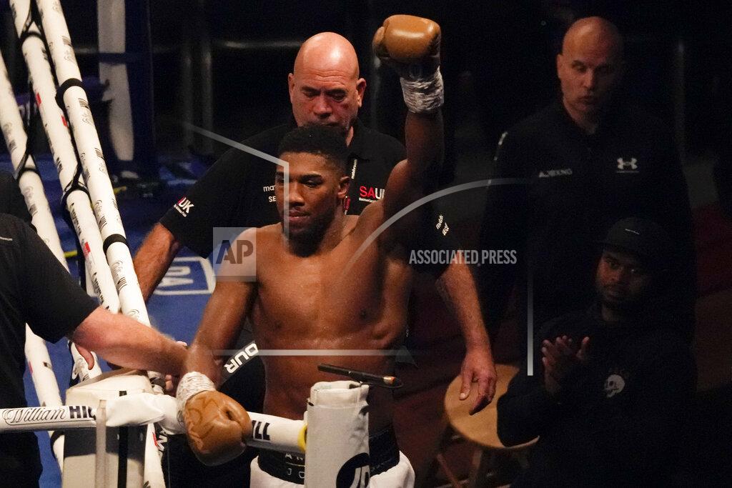Frank Augstein Anthony Joshua of Britain waves to spectators after his defeat to Oleksandr Usyk of Ukraine in their WBA (Super), WBO and IBF boxing title bout at the Tottenham Hotspur Stadium in London, Saturday, Sept. 25, 2021. (AP Photo/Frank Augstein)