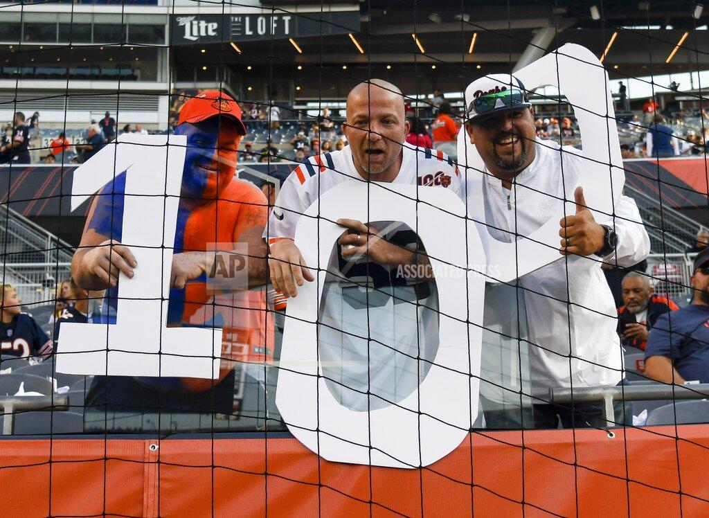 David Banks Fan get ready for the start of an NFL football game between the Green Bay Packers and the Chicago Bears at Soldier Field Thursday, Sept. 5, 2019, in Chicago. (AP Photo/David Banks)