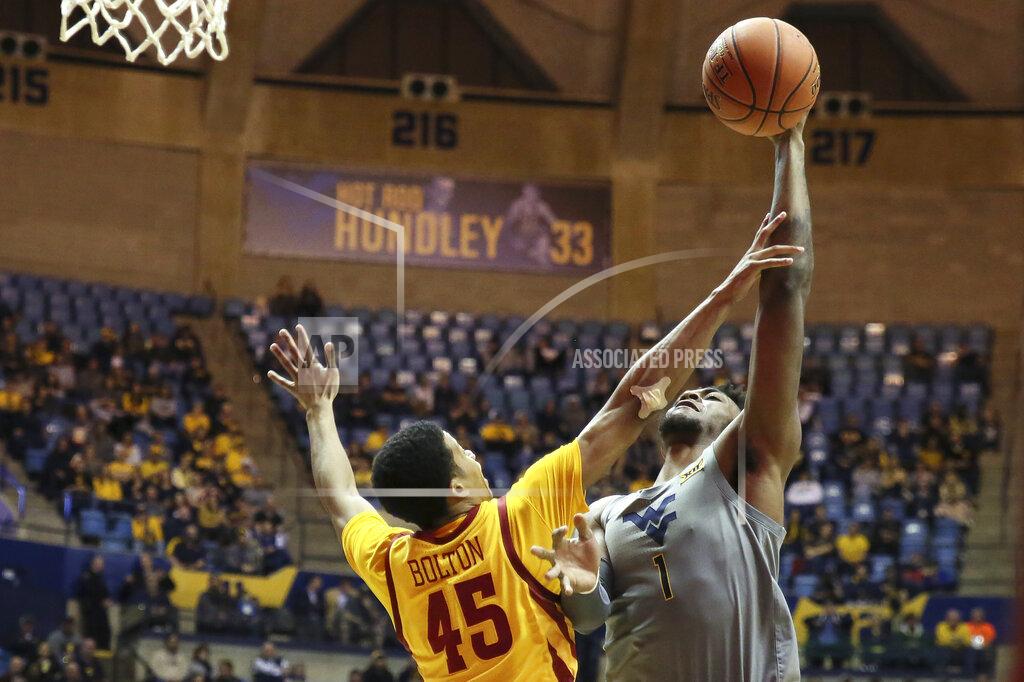 Kathleen Batten West Virginia forward Derek Culver (1) shoots as he is defended by Iowa State guard Rasir Bolton (45) during the second half of an NCAA college basketball game Wednesday, Feb. 5, 2020, in Morgantown, W.Va. (AP Photo/Kathleen Batten)