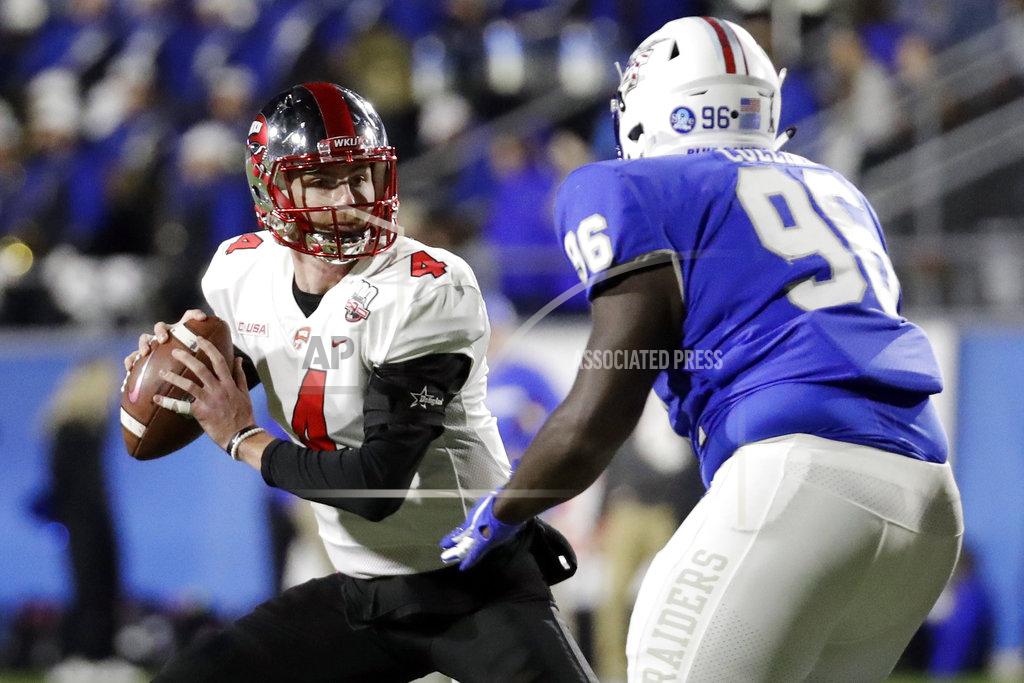 Mark Humphrey Western Kentucky quarterback Drew Eckels (4) is pressured by Middle Tennessee defensive lineman Rosheem Collins (96) in the first half of an NCAA college football game Friday, Nov. 2, 2018, in Murfreesboro, Tenn. (AP Photo/Mark Humphrey)