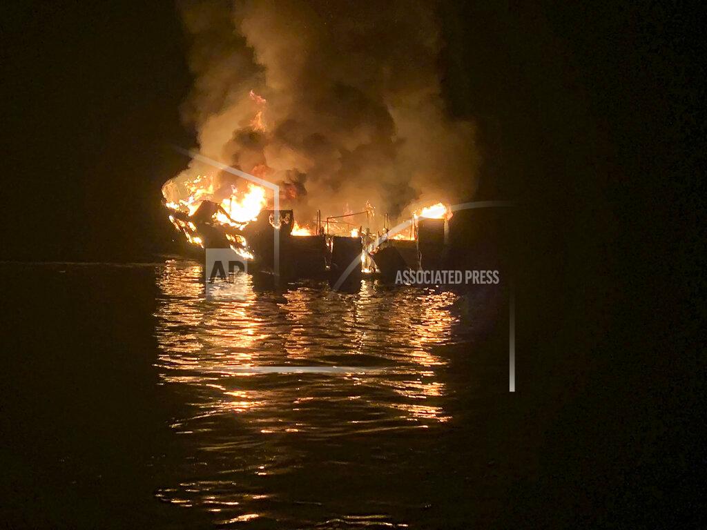 Uncredited FILE - In this Sept. 2, 2019, file photo provided by the Santa Barbara County Fire Department, is the Conception dive boat engulfed in flames after a deadly fire broke out aboard the commercial scuba diving vessel off the Southern California Coast. The families of the 34 people who perished have formed a group they're calling "Advocacy34" to push for strengthened boating regulations and requirements for passenger vessels, such as improved fire and safety training protocols and the installation and use of monitoring devices that would ensure there's a night watch on deck. (Santa Barbara County Fire Department via AP, File)