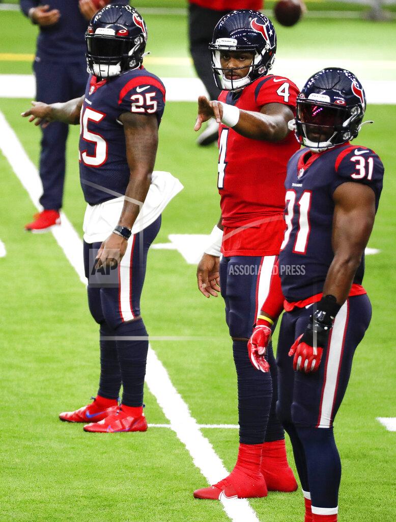 Houston Texans quarterback Deshaun Watson (4) calls out signals as he lines up with running backs Duke Johnson (25) and David Johnson (31) during NFL football training camp Thursday, Aug. 27, 2020, in Houston. (Brett Coomer/Houston Chronicle via AP, Pool)