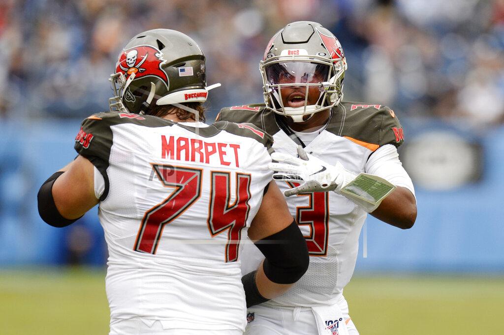 Mark Zaleski Tampa Bay Buccaneers quarterback Jameis Winston (3) celebrates with offensive guard Ali Marpet (74) after the Buccaneers scored a touchdown against the Tennessee Titans in the second half of an NFL football game Sunday, Oct. 27, 2019, in Nashville, Tenn. (AP Photo/Mark Zaleski)