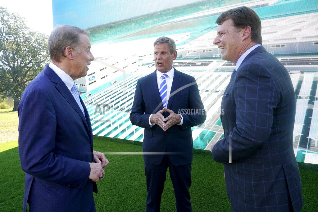 Mark Humphrey Ford Executive Chairman Bill Ford, left, and Jim Farley, Ford president and CEO, right, talk with Tennessee Gov. Bill Lee, center, after a presentation on the planned factory to build electric F-Series trucks and the batteries to power future electric Ford and Lincoln vehicles Tuesday, Sept. 28, 2021, in Memphis, Tenn. The plant in Tennessee is to be built near Stanton, Tenn. (AP Photo/Mark Humphrey)