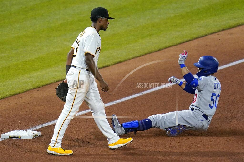 Gene J. Puskar Los Angeles Dodgers' Mookie Betts (50) slides safely into third past Pittsburgh Pirates third baseman Ke'Bryan Hayes with an RBI triple during the fifth inning of a baseball game in Pittsburgh, Tuesday, June 8, 2021. (AP Photo/Gene J. Puskar)