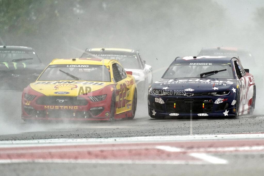 Chuck Burton Joey Logano (22) and Tyler Reddick (8) lead other cars out of Turn 18 during the NASCAR Cup Series auto race at the Circuit of the Americas in Austin, Texas, Sunday, May 23, 2021. (AP Photo/Chuck Burton)