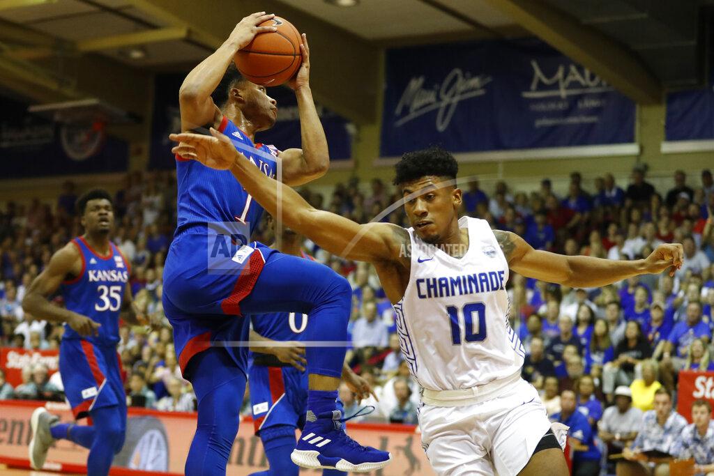 Marco Garcia Kansas guard Devon Dotson (1) shoots over Chaminade guard Andre Arissol (10) during an NCAA college basketball game Monday, Nov. 25, 2019, in Lahaina, Hawaii. (AP Photo/Marco Garcia)