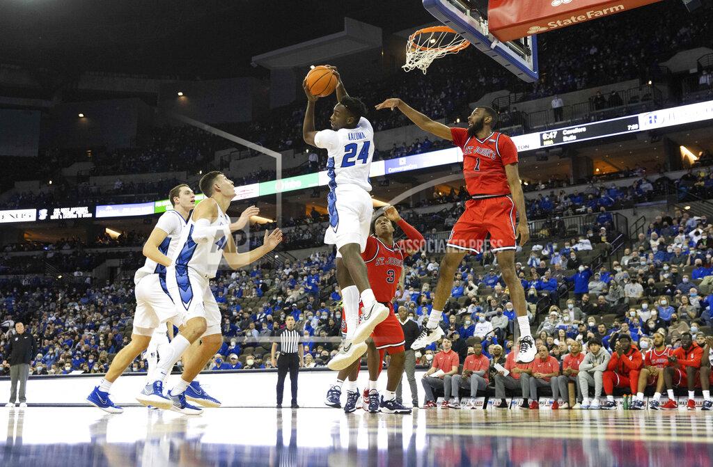 Rebecca S. Gratz Creighton's Arthur Kaluma (24) pulls down a rebound against St. John's Aaron Wheeler (1) during the first half of an NCAA college basketball game Wednesday, Jan. 19, 2022, in Omaha, Neb. (AP Photo/Rebecca S. Gratz)