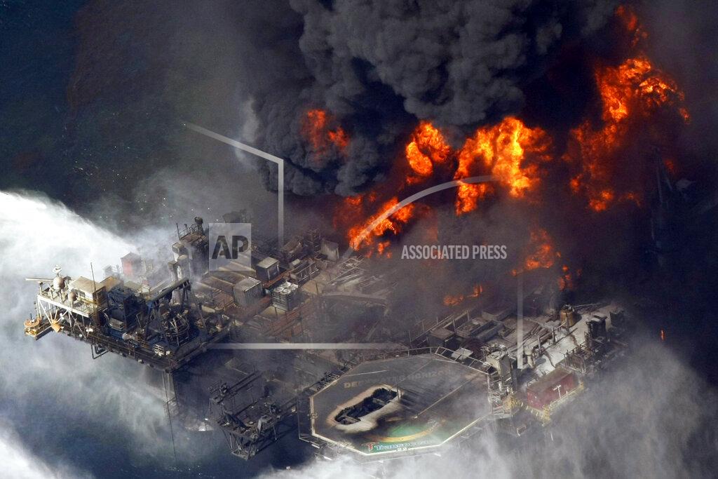 Gerald Herbert FILE - In an April 21, 2010, file photo taken in the Gulf of Mexico more than 50 miles southeast of Venice, La., the Deepwater Horizon oil rig burns. As oil spewed into the Gulf of Mexico from a blown-out BP well in 2010, residents wondered whether their home would ever be the same. The Deepwater Horizon disaster changed the region, with a flood of spending altering landscapes and attitudes. (AP Photo/Gerald Herbert, File)
