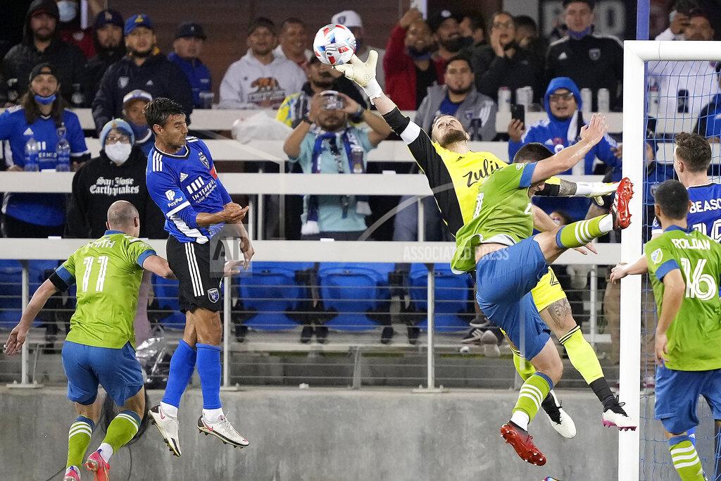 Tony Avelar Seattle Sounders goalkeeper Stefan Frei (24) bats the ball away from San Jose Earthquakes forward Chris Wondolowski, second from left, during the second half of an MLS soccer match Wednesday, May 12, 2021, in San Jose, Calif. The Seattle Sounders won 1-0. (AP Photo/Tony Avelar)