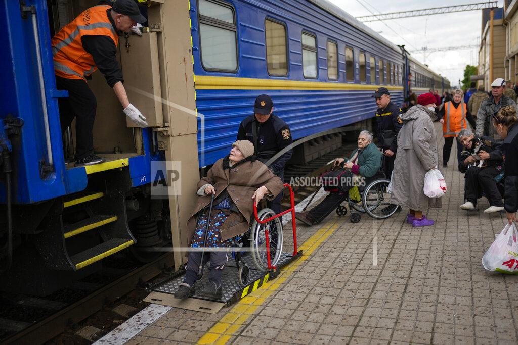 Francisco Seco People fleeing from heavy shelling board an evacuation train at Pokrovsk train station, in Pokrovsk, eastern Ukraine, Sunday, May 22, 2022. Civilians fleeing areas near the eastern front in the war in Ukraine Sunday described scenes of devastation as their towns and villages came under sustained attack from Russian forces. (AP Photo/Francisco Seco)