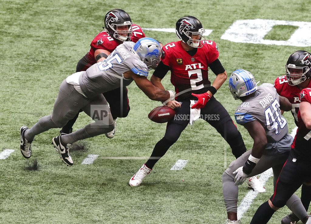 Curtis Compton Detroit Lions defensive end Romeo Okwara, bottom left, gets past Atlanta Falcons tackle Jake Matthews, top left, to strip sack Falcons quarterback Matt Ryan (2) during the fourth quarter of an NFL football game Sunday, Oct. 25, 2020, in Atlanta. The Lions recovered the ball. (Curtis Compton/Atlanta Journal-Constitution via AP)