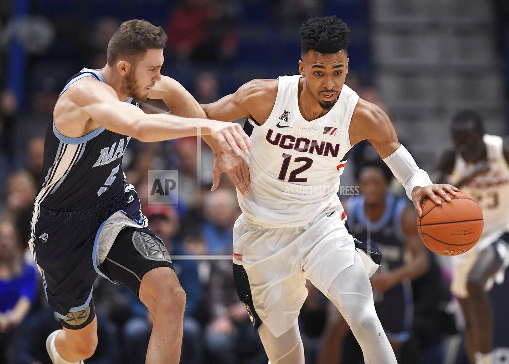 Jessica Hill Connecticut's Tyler Polley is pressured by Maine's Nedeljko Prijovic, left, during the first half of an NCAA college basketball game Sunday, Dec. 1, 2019, in Hartford, Conn. (AP Photo/Jessica Hill)