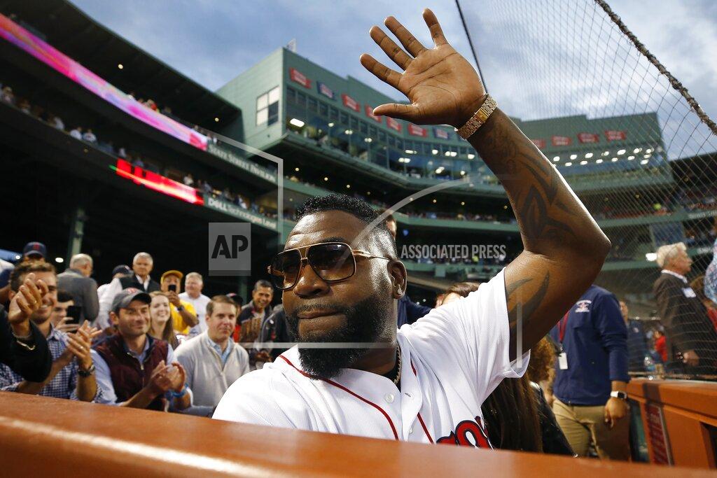Michael Dwyer Former Boston Red Sox's David Ortiz waves to the crowd after throwing out a ceremonial first pitch before a baseball game against the New York Yankees in Boston, Sept. 9, 2019. (AP Photo/Michael Dwyer)