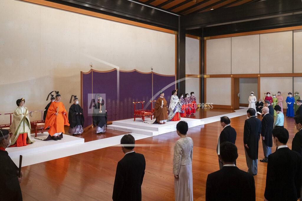 Handout In this photo provided by the Imperial Household Agency of Japan, Japan's Crown Prince Akishino, second from left, flanked by his wife Crown Princess Kiko, left, attends a ceremony for formally proclaims Akishino is the first in line to the Chrysanthemum Throne with Emperor Naruhito, center left, and Empress Masako, center right, at the Imperial Palace in Tokyo, Sunday, Nov. 8, 2020. Akishisho, Naruhito's younger brother, was formally sworn in as first in line to the Chrysanthemum Throne in a traditional palace ritual that has been postponed for seven month and scaled down due to the coronavirus pandemic. (Imperial Household Agency of Japan via AP)