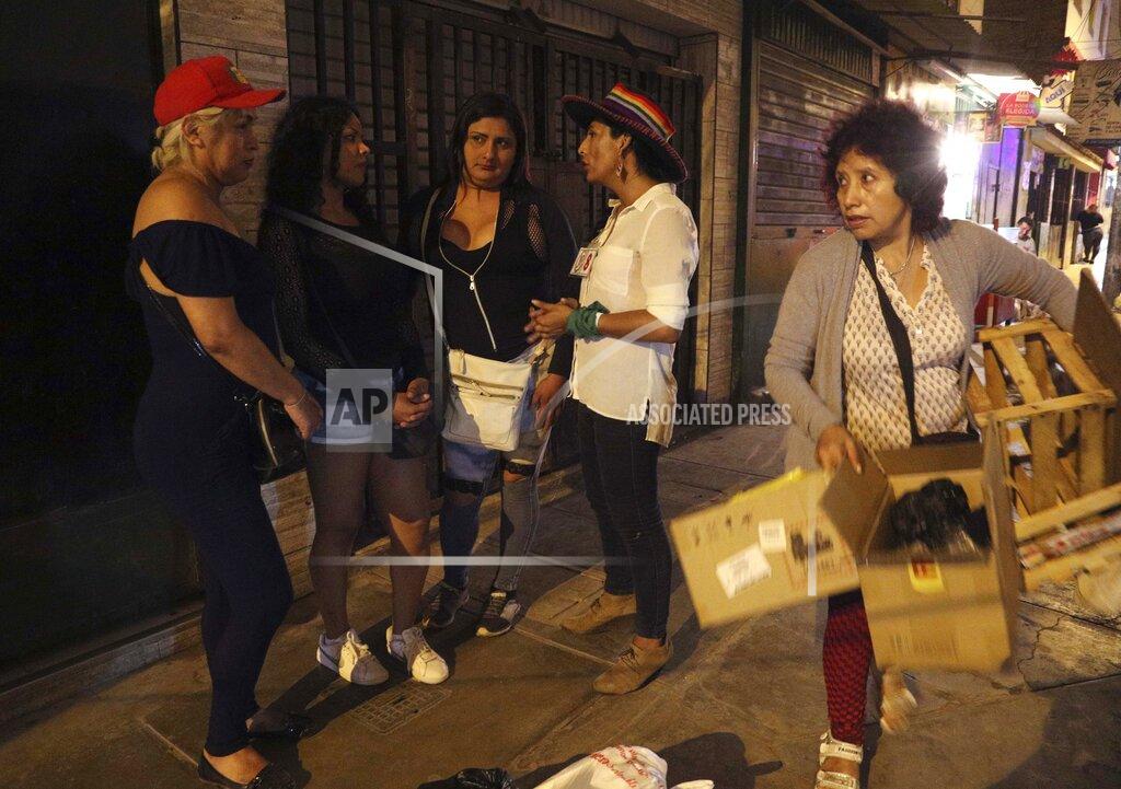 Martin Mejia FILE - In this Jan. 20, 2020 file photo, transgender congressional candidate Gahela Cari, second right, in her first unsuccessful run for Congress tries to convince transgender sex workers to vote, in Lima, Peru. Cari herself worked as a prostitute for more than a year on the streets of Lima, many of which she travels to spread her campaign message. (AP Photo/Martin Mejia, File)