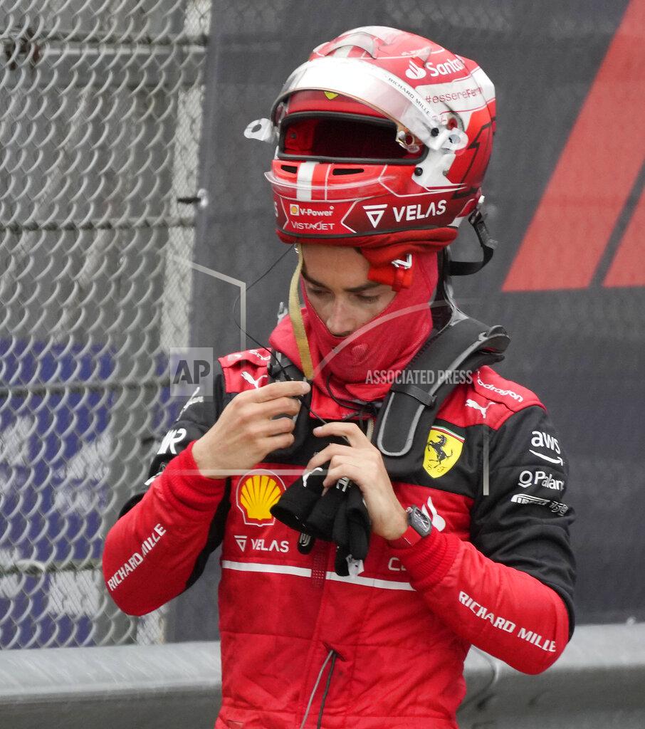 Luca Bruno Ferrari driver Charles Leclerc of Monaco stands at the end of the Emilia Romagna Formula One Grand Prix, at the Enzo and Dino Ferrari racetrack, in Imola, Italy, Sunday, April 24, 2022. (AP Photo/Luca Bruno)